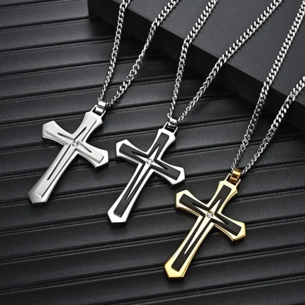 Three silver and gold cross necklaces.