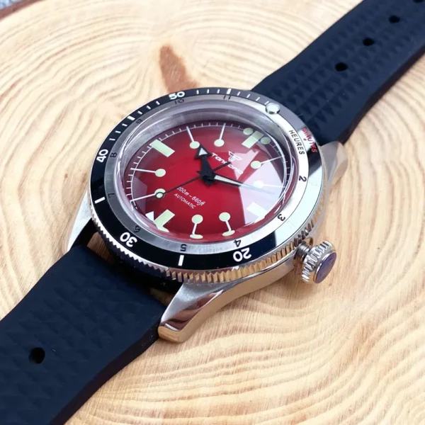 Red-faced dive watch with black bezel.