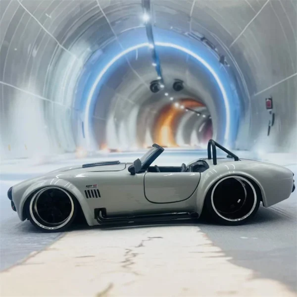 White Cobra roadster toy car in tunnel.