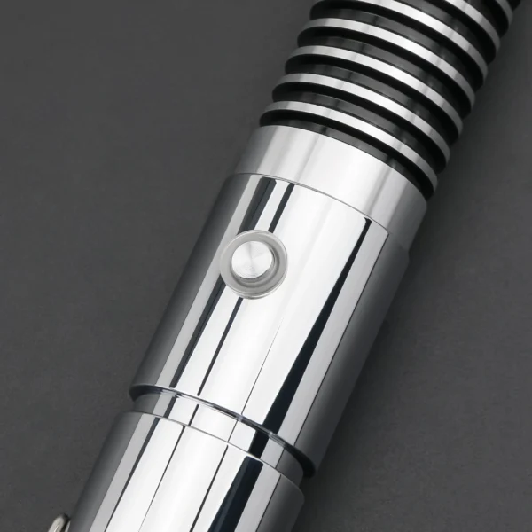 Close-up of a silver lightsaber hilt.