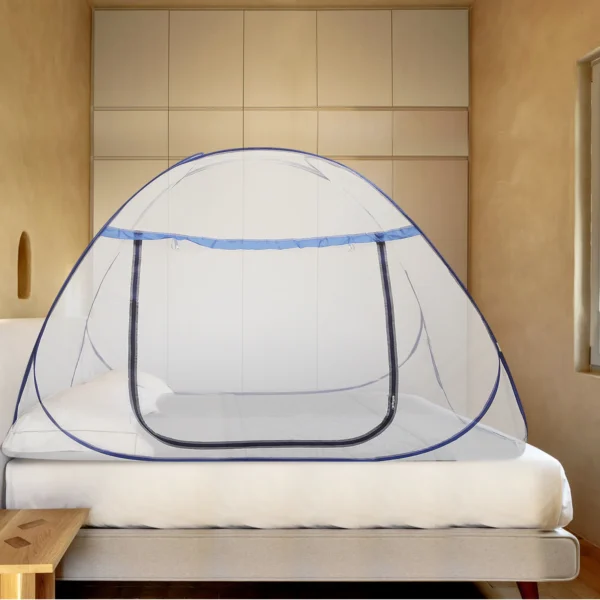 Blue and white mosquito net over a bed.