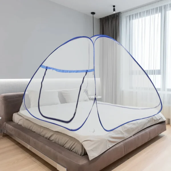 A blue mosquito net over a bed.