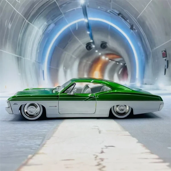 Green and white classic car in tunnel.