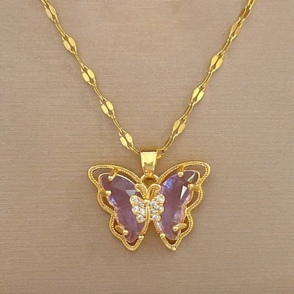 Gold chain with purple butterfly pendant.