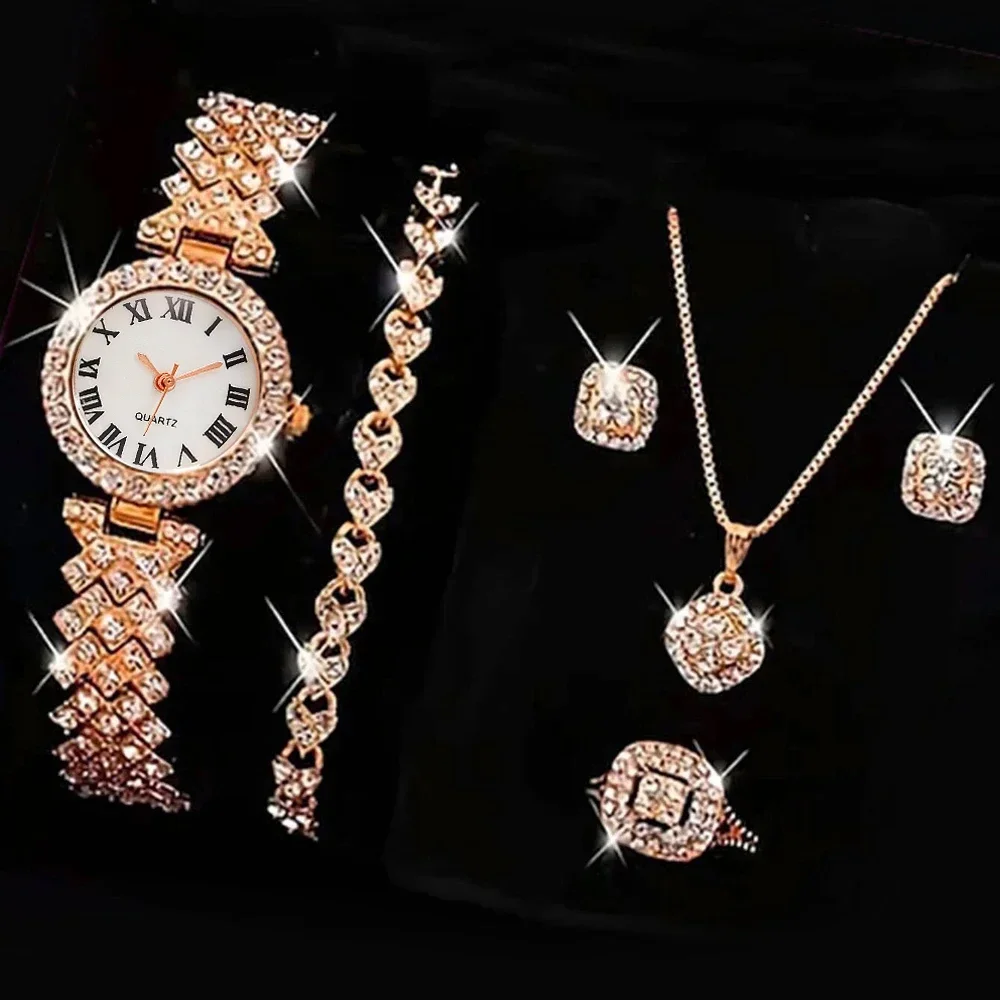 Gold jewelry set with watch and ring.