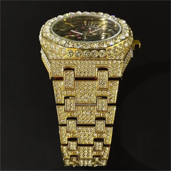 Gold and diamond wristwatch with a black face.