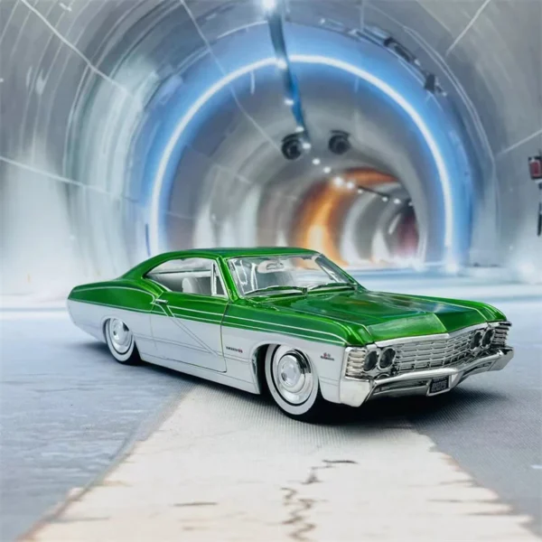 Green and white classic car in tunnel.