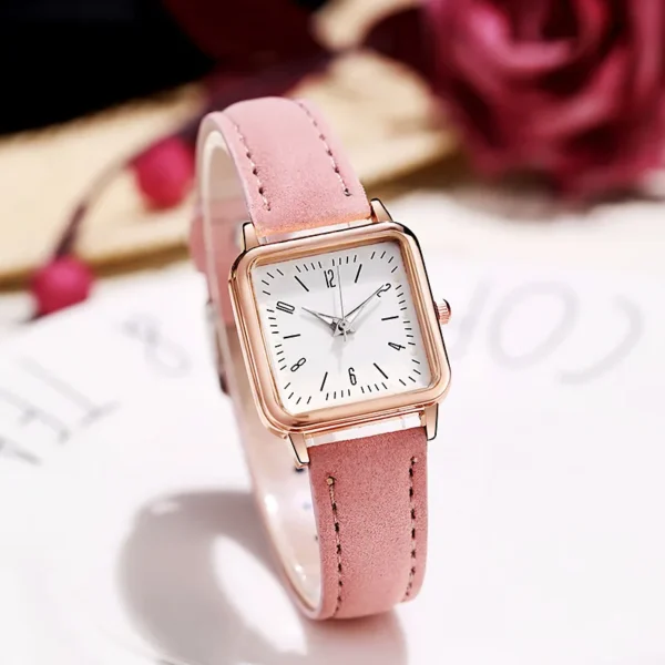 Pink leather wristwatch with square face.