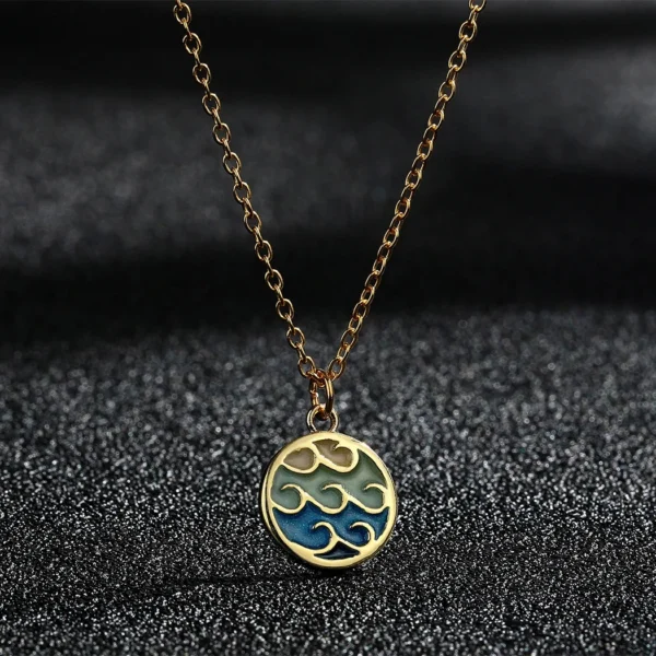 Gold chain with wave pendant necklace.