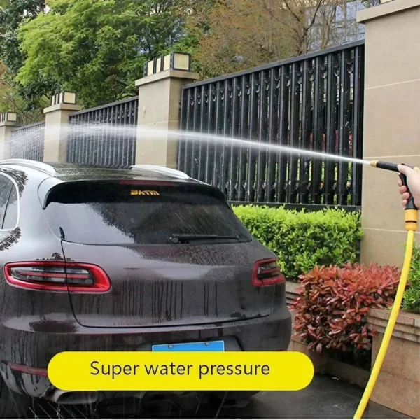 Car being washed with high pressure water.