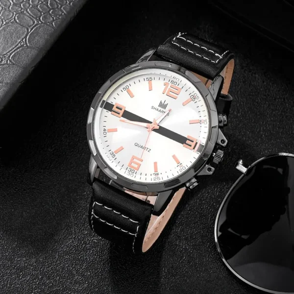 Black leather band wristwatch with white face.