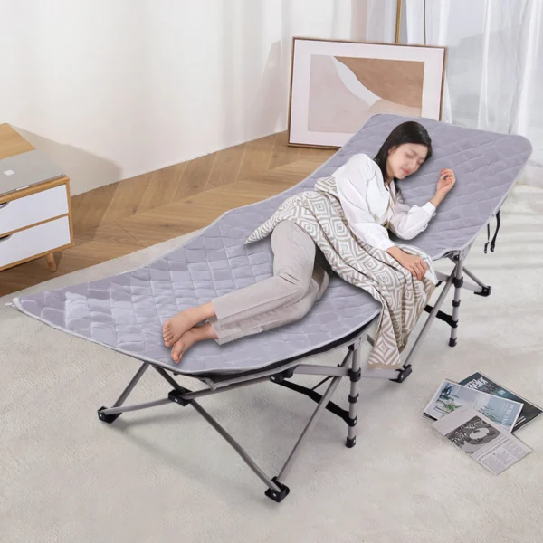 Woman sleeping on a gray folding cot.