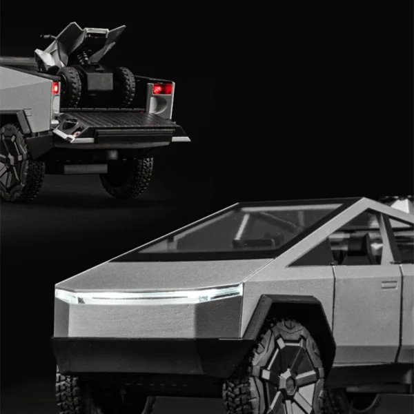 Silver Tesla Cybertruck model with ATV.