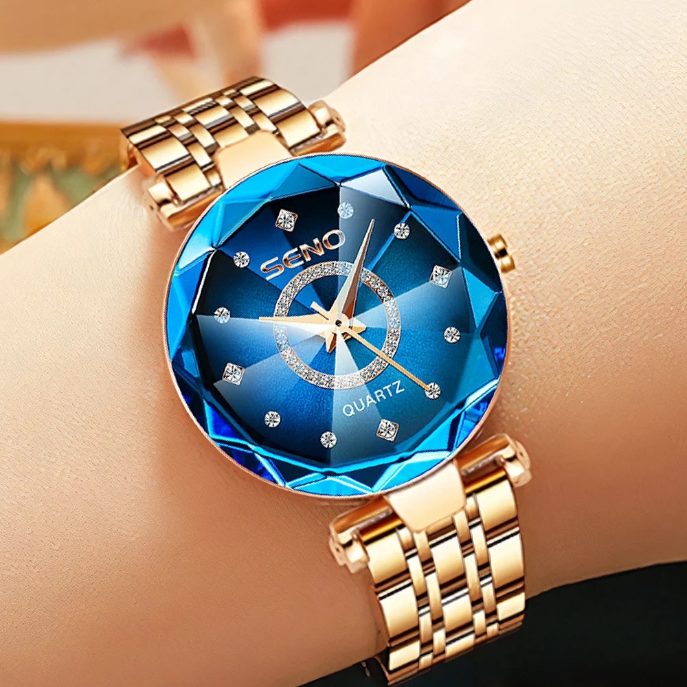 Gold watch with blue face and diamonds.