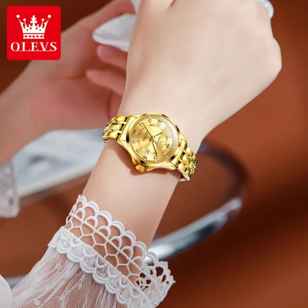 Gold wristwatch with diamond accents.