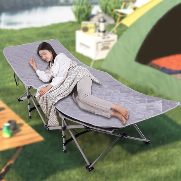 Woman sleeping on a camping cot.