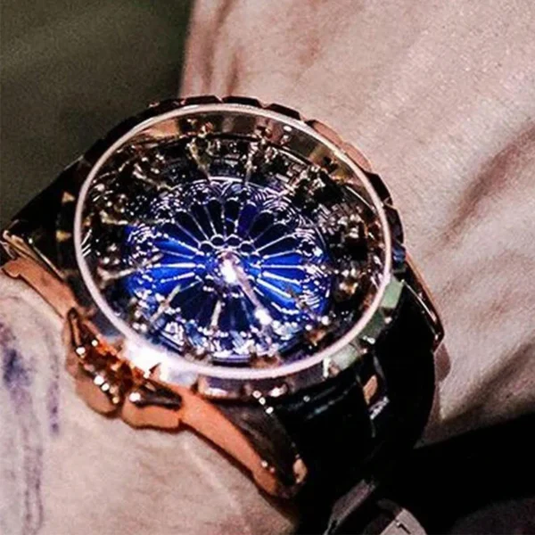 Gold wristwatch with blue face and intricate details.