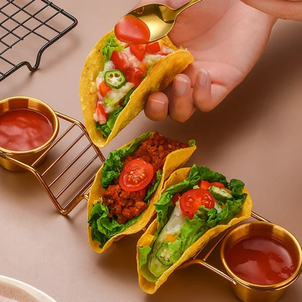 Three tacos with salsa and a spoon.