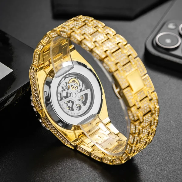 Gold watch with diamond encrusted band.