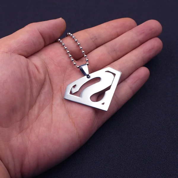 Silver Superman pendant necklace on hand.