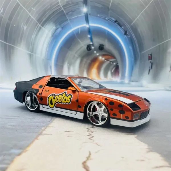 Orange Cheeto-themed car in tunnel.