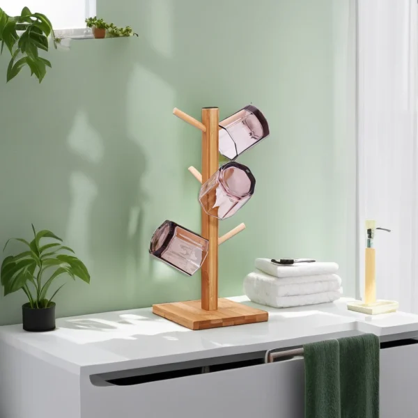 Wooden mug tree with glasses hanging.