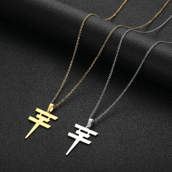 Gold and silver necklaces with symbol pendants.