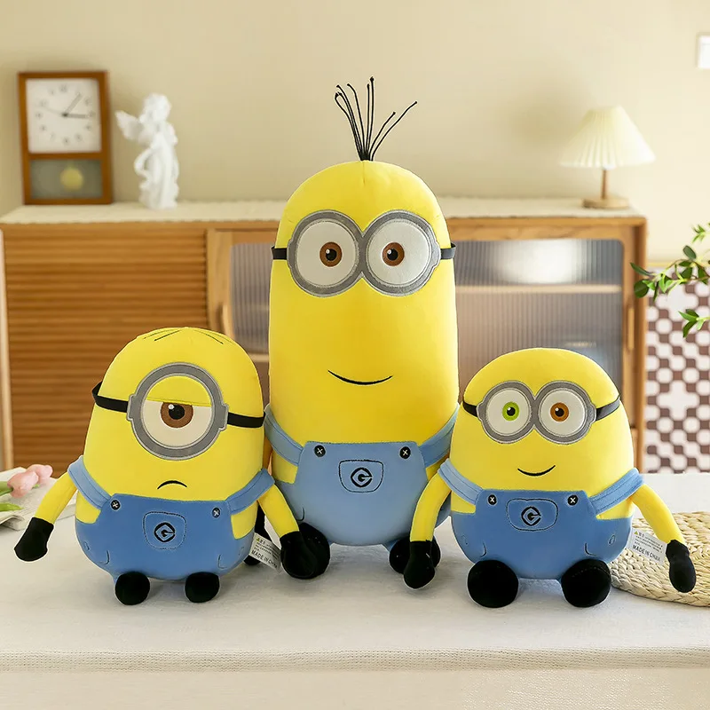 Three yellow Minion plush toys.