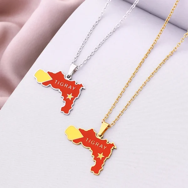 Two gold necklaces with Tigray map pendants.