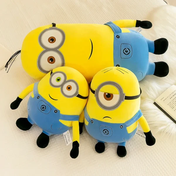 Three yellow Minion plush toys.