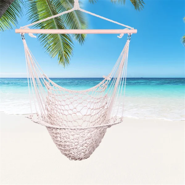 White hanging hammock on beach.