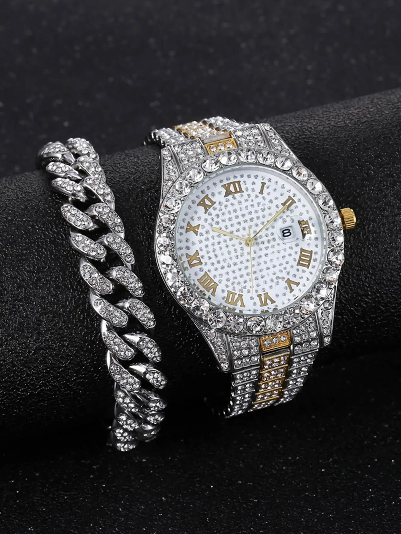 Diamond studded watch with chain bracelet.