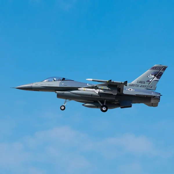 Gray F-16 fighter jet in flight.