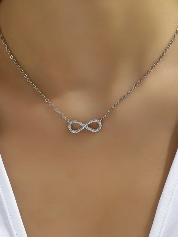 Silver infinity necklace with crystal accents.