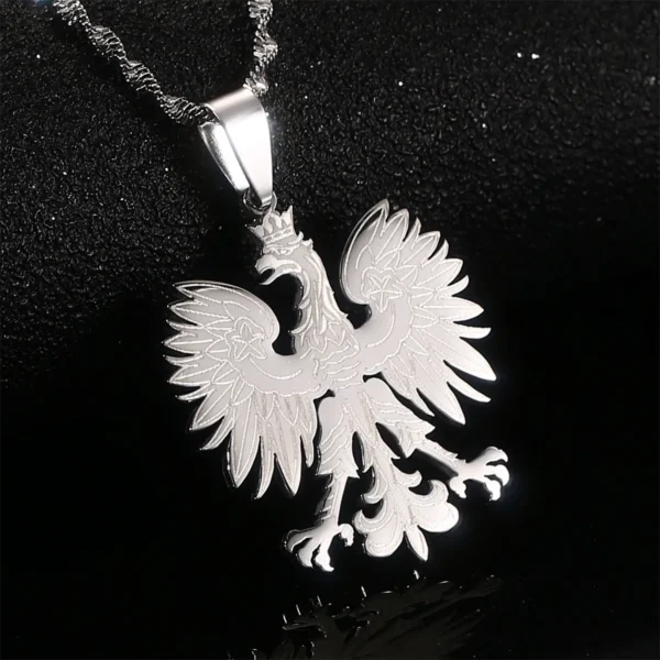 Silver eagle pendant necklace on black background.