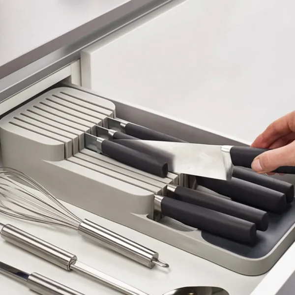 Gray knife organizer with multiple blades.