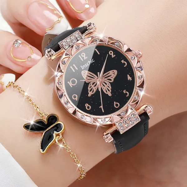 Black leather watch with butterfly design.