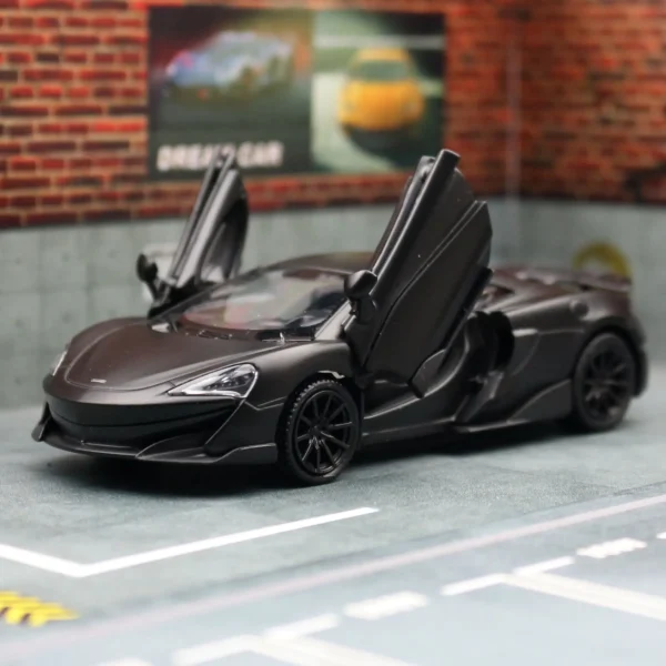 Black toy car with open doors.