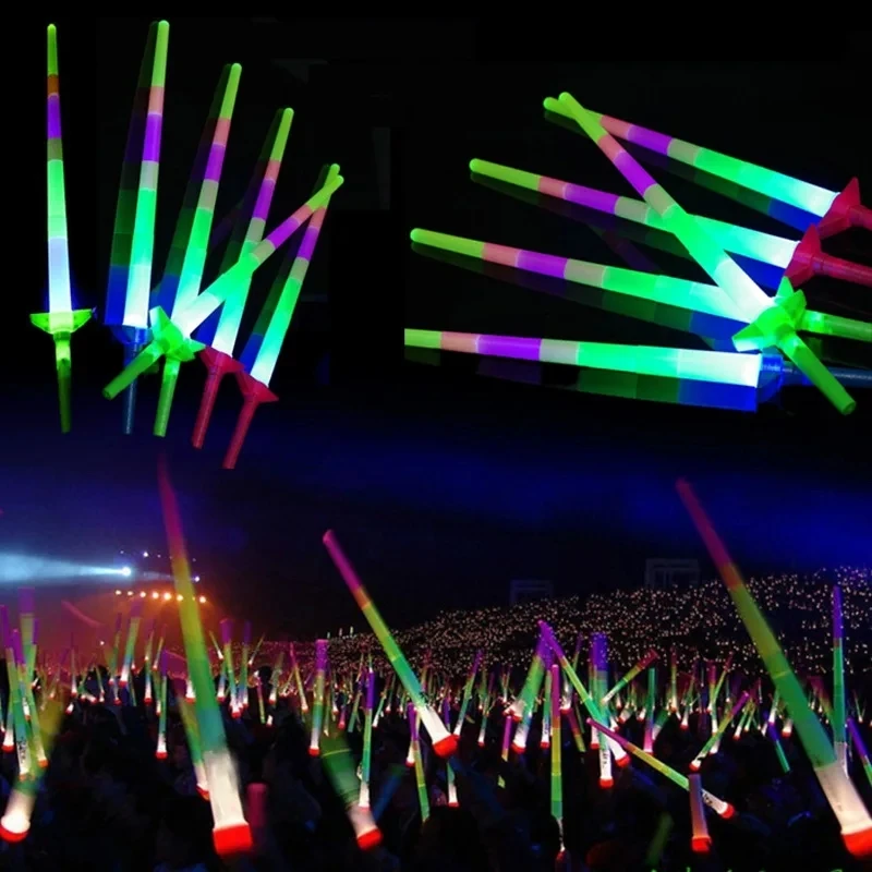 Multicolored glow sticks in a concert crowd.