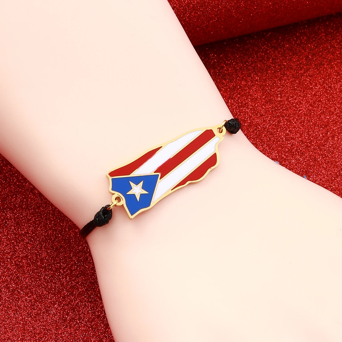 Puerto Rican flag bracelet on wrist.