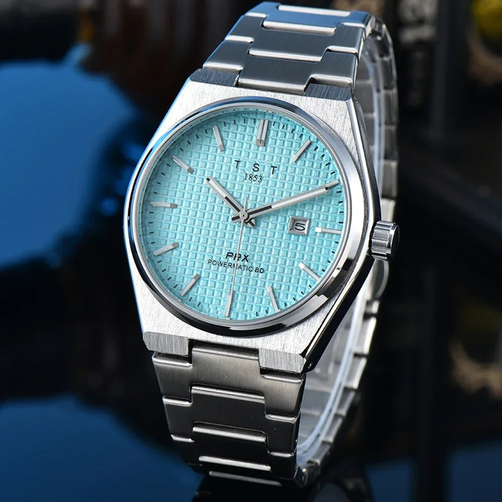 Silver watch with blue face and date display.