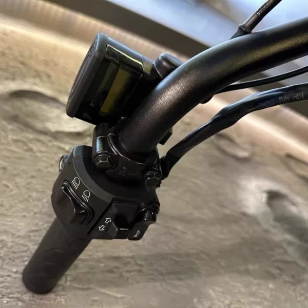 Motorcycle handlebar with controls and lights.