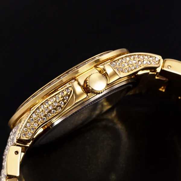 Gold watch with diamond bezel.