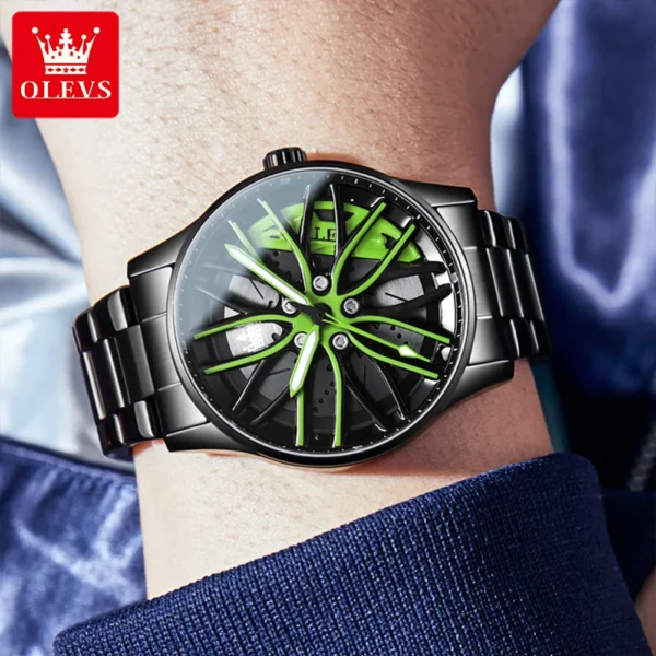 Black and green rim watch on wrist.