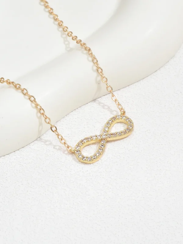 Gold infinity necklace with cubic zirconia.