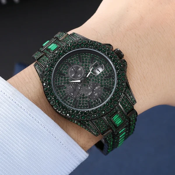 Black watch with green crystal accents.