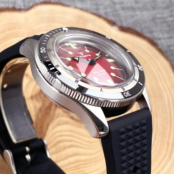 Red-faced dive watch with black rubber band.