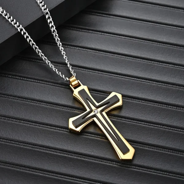 Gold and black cross pendant necklace.