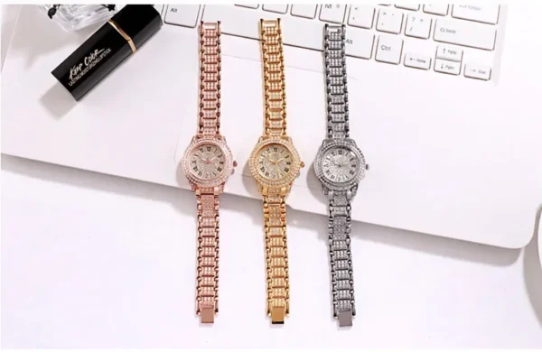 Three diamond-encrusted watches on white background.