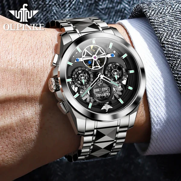 Man's wrist wearing silver automatic watch.